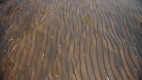 Water-ripples-and-sand-texture
