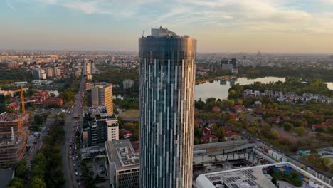 Rotating-Aerial-View-of-Bucharest's-Skyline-at-Sunset