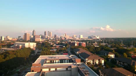 A-rising-drone-shot-of-Atlanta-skyline-during-golden-hour-on-a-summer-evening
