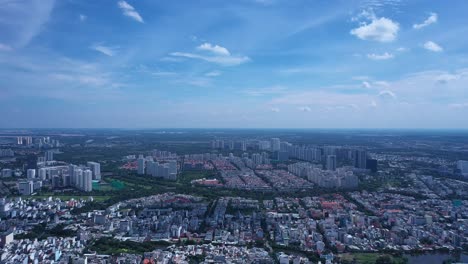 Ho-Chi-Minh-City-drone-panorama-of-district-seven-on-sunny-day-with-blue-sky-and-moving-clouds
