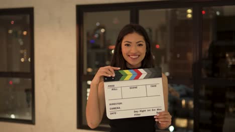 beautiful-young-asian-woman-happy-smiling-clapperboard-cinema-home