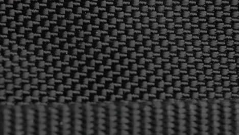 Close-up-Moving-Macro-Shot-of-Black-Nylon-Fabric