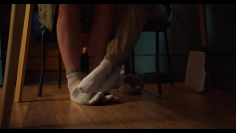 Shooting-up-close:-a-view-of-the-legs-of-a-girl-and-a-guy-who-touch-each-other-in-socks