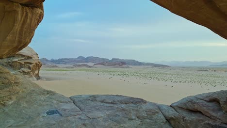 Flying-Through-Natural-Arches-In-Wadi-Rum-Protected-Area,-Southern-Jordan,-Middle-East