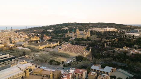 Aerial-panoramic-establishing-view-of-Museu-Nacional-d'Art-de-Catalunya,-at-sunset,-Barcelona-Spain