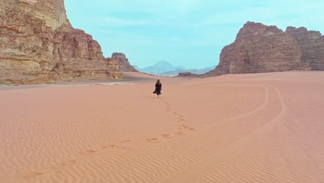 Woman-Strolling-On-Arid-Desert-Of-Wadi-Rum-In-Aqaba,-Jordan