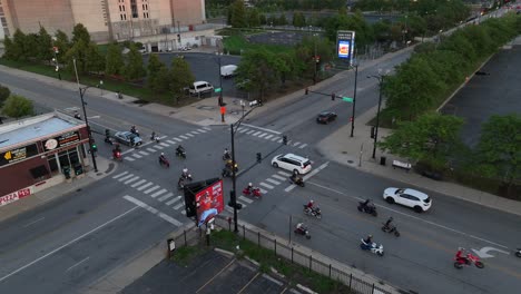 People-riding-motorcycles,-street-bikes,-and-dirt-bikes-on-inner-city-Chicago-street