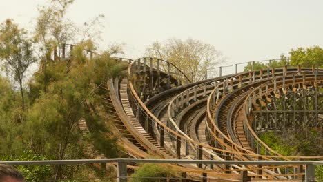 Pan-shot-of-the-wooden-Stampida-roller-coaster-in-Port-Aventura-Park,-Salou,-Spain