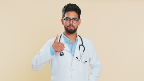 Doctor-man-raises-thumbs-up-agrees-or-gives-positive-reply-recommends-advertisement-likes-good-idea