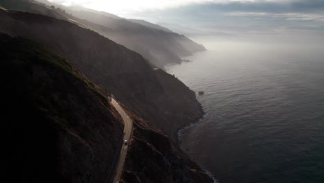 Lone-vehicle-on-California's-State-Route-1,-epic-aerial-view,-Big-Sur