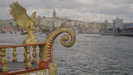 Galata-Tower-from-Eminonu-Pier-with-golden-figurehead-of-fish-boat-cafe