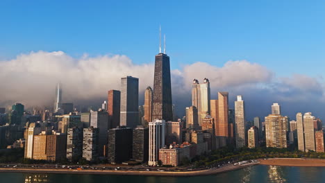 Aerial-view-circling-lakefront-skyscrapers-in-Streeterville,-sunrise-in-Chicago
