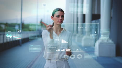 Business-woman-operates-Hologram-HUD-overlay-with-various-windows-and-statistics-using-touch-gestures