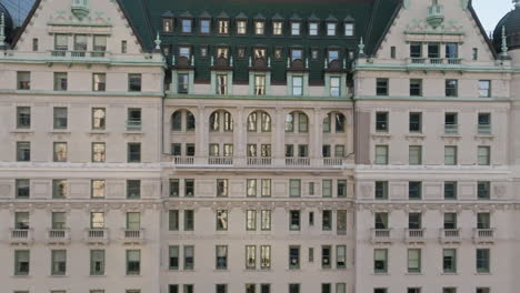 Aerial-view-toward-windows-and-balcony-on-the-Plaza-hotel,-sunset-in-New-York