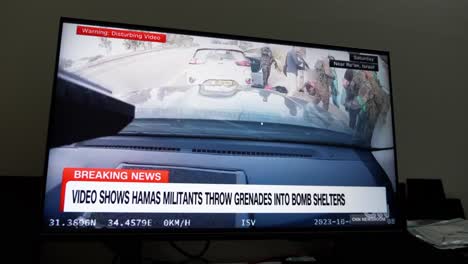 Watching-the-CNN-breaking-news,-a-live-telecast-on-the-attack-on-Israel-by-the-Hamas-militant-group-on-October-7,-2023-which-killed-hundreds-of-people