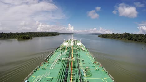 Timelapse-oil-tanker-bow-view-crossing-transit-panama-canal-gatun-lake-sunny-day