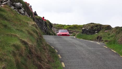 Rally-Car-Ireland-narrow-mountain-road-with-people-taking-photos-in-West-Cork-Ireland