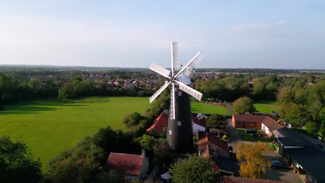 High-in-the-sky,-video-footage-offers-a-view-of-the-famous-Waltham-Windmill-and-Rural-History-Museum-in-Lincolnshire,-UK