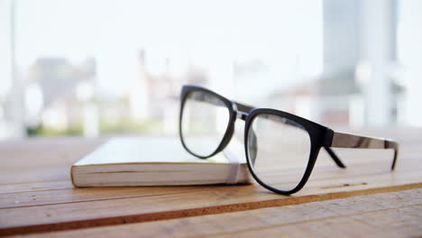 Close-up-of-spectacles-on-book-4k