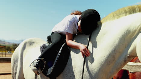 Girl-embracing-the-white-horse-in-the-ranch-4k