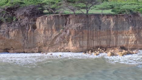 Lateral-flight-showing-waves-crashing-against-cliffs-at-Matanzas-Beach-on-Dominican-Republic-Island