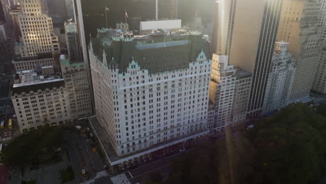 Aerial-view-circling-the-Plaza-hotel,-sunny-evening-in-Manhattan,-New-York,-USA