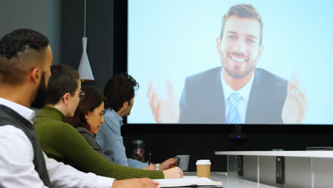 Executives-interacting-through-video-call-in-conference-4k