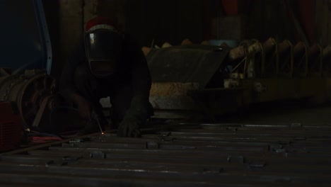 Male-worker-using-welding-torch-in-the-workshop-4k
