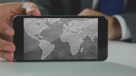 Digital-generated-video-of-businessman-holding-mobile-phone-with-world-map-4k