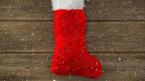 Falling-snow-with-Christmas-stocking-decoration