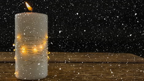 Falling-snow-with-Christmas-candle-decoration