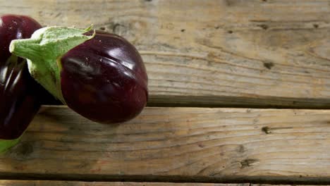 Two-eggplant-on-wooden-table-4k