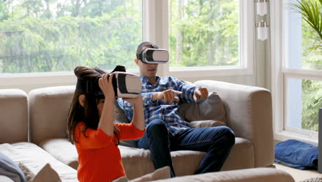 Father-and-daughter-using-virtual-reality-headset-4k