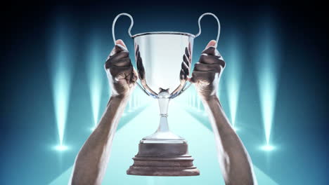 Hands-holding-Silver-Trophy-Video
