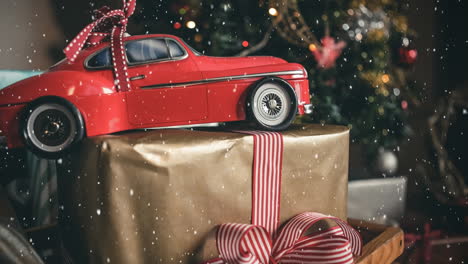 Rotes-Modellauto-Und-Ein-Weihnachtsgeschenk-Kombiniert-Mit-Fallendem-Schnee