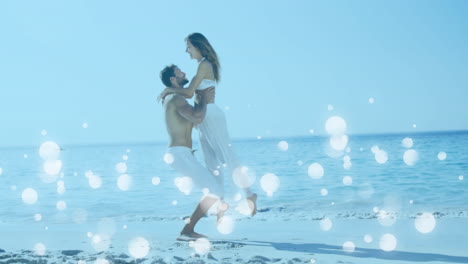 Couple-enjoying-at-the-beach-surrounded-by-white-bubbles-effect