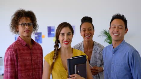 Happy-multi-ethnic-business-colleagues-standing-together-in-modern-office-4k