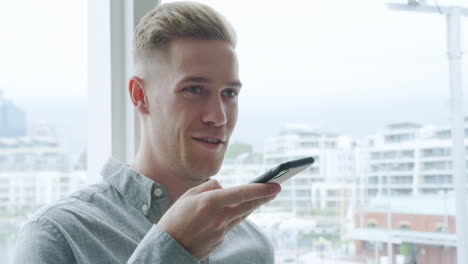 Man-using-smartphone-in-a-modern-office