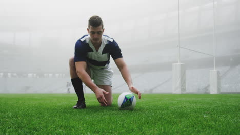Male-rugby-player-tying-shoelaces-in-the-stadium-4k
