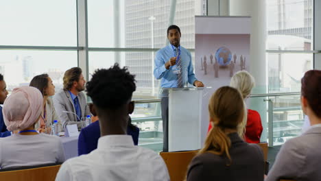 African-american-male-speaker-speaking-in-a-business-seminar-4k