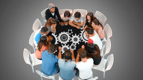 A-group-of-people-in-a-round-table-and-gears