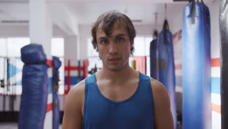 Front-view-of-caucasian-man-at-the-boxing-gym
