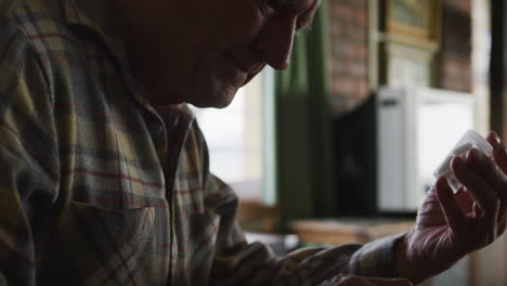 Senior-man-using-laptop-at-home