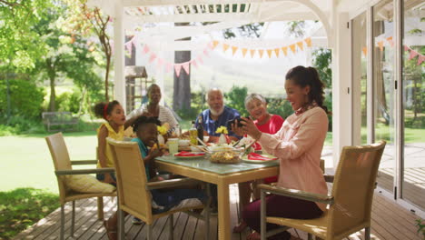 Multi-generation-African-American-family-spending-time-in-garden-together