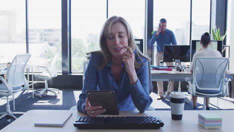 Woman-using-digital-tablet-and-talking-to-camera