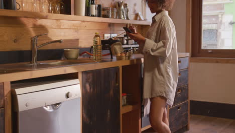 Mixed-race-woman-preparing-breakfast-at-home