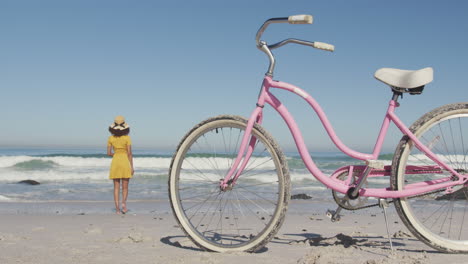 African-American-woman-seaside-with-a-bike-