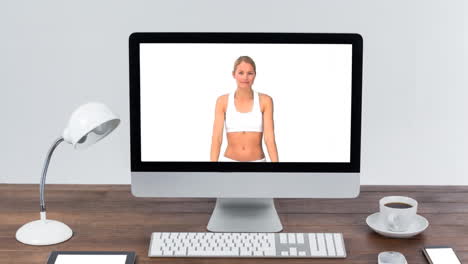 Animation-of-a-computer-monitor-showing-Caucasian-woman-exercising-with-dumbbells