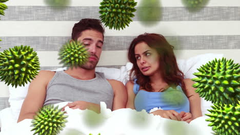 Animation-of-green-corona-virus-with-sick-couple-in-background