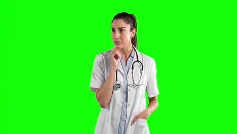 Animation-Einer-Kaukasischen-Frau-In-Chirurgenbluse-Und-Gestrüpp-Vor-Grünem-Hintergrund